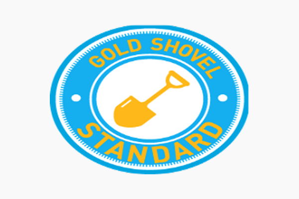 Gold Shovel Standard logo with shovel icon.