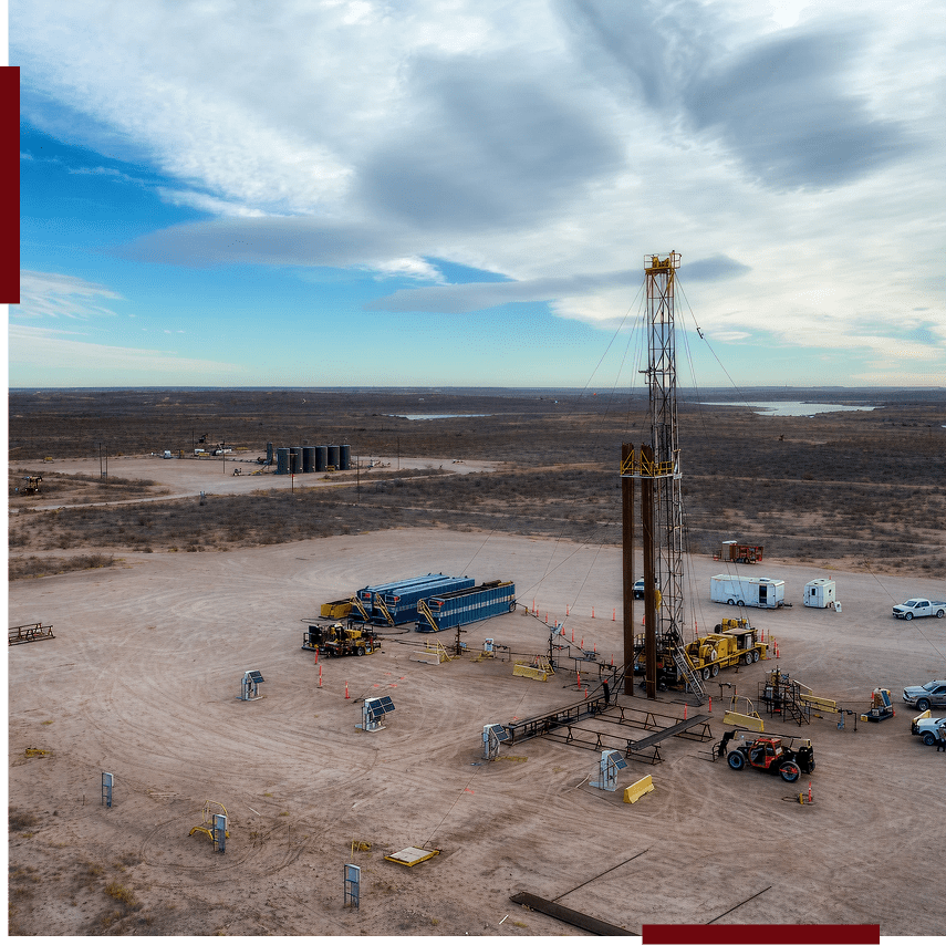 Oil drilling rig in a desert landscape.